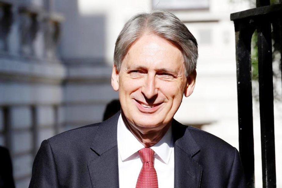 Philip Hammond, Britain's Chancellor of the Exchequer, arrives in Downing Street, in central London.