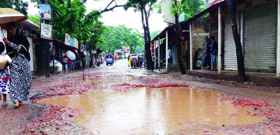 SHARIATPUR: The 35-km dilapidated Alubazar- Madaripur Highway has turn into a death trap with big potholes in different places which needs immediate repair. This snap was taken yesterday.