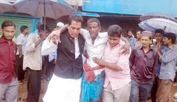 Chairman of Raozan Upazila Ehsanul Haider Chowdhury Babul seen rescuing a flood affected people of Raozan who flown away by the tide of flash flood water recently.