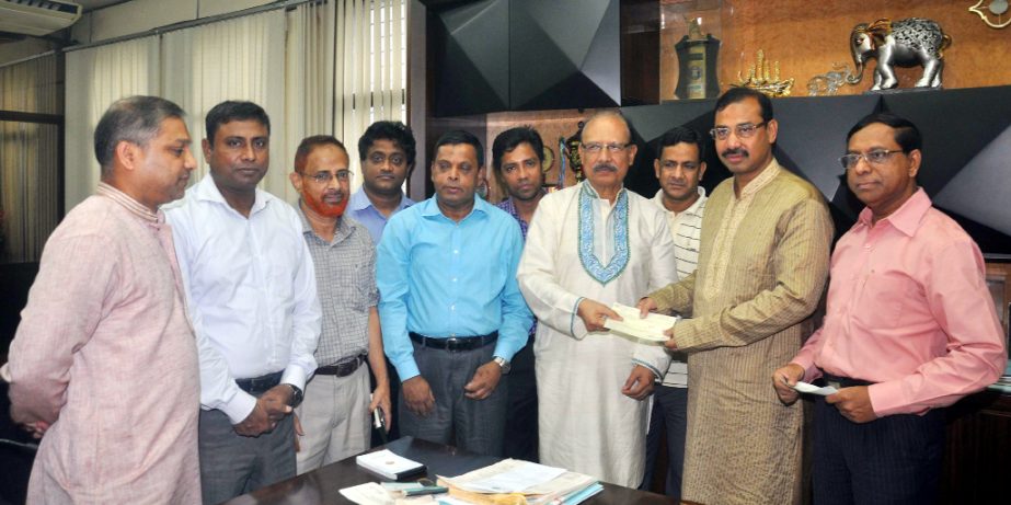 CCC Mayor A J M Nasir Uddin receving a cheque from A K M Jazlulllah, Managing Director, Chittagong WASA for road construction at his office on Saturday.