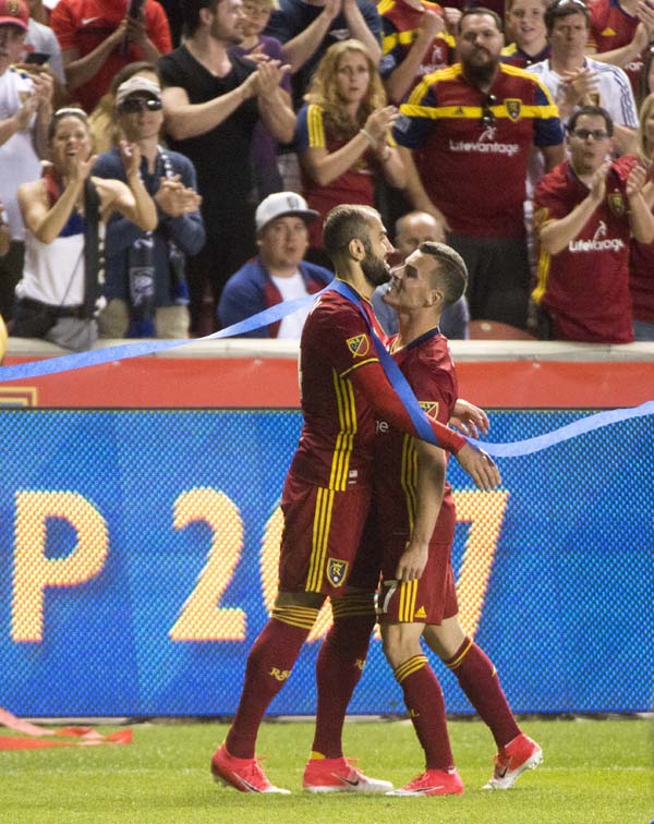 Real Salt Lake forward Brooks Lennon (27) celebrates the goal by forward Yura Movsisyan, left, against Minnesota United during an MLS soccer match in Sandy, Utah, Saturday.