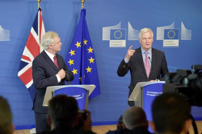The European Union's Chief Brexit negotiator Michael Barnier Â® welcomes Britain's Secretary of State for Exiting the European Union David Davis at the European Commission ahead of their first day of talks in Brussels on Monday.