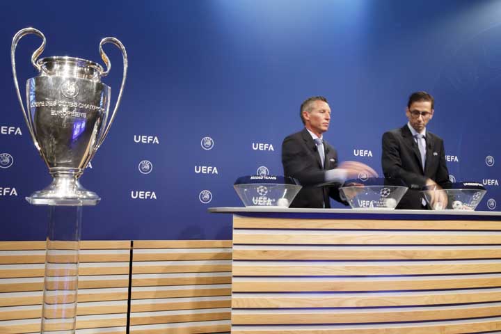 Michael Heselschwerdt, Head of Club Competition and Tobias Hedtstueck (right), Club Competition Regulation remove the balls containing the names of the soccer clubs during the drawing of the games for the Champions League 201718 Second qualifying round a