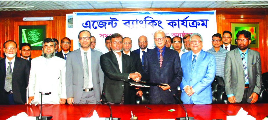 Md. Abdul Hamid Miah, Managing Director of Islami Bank Bangladesh Limited and Md. Hemayet Hossain, PhD, Executive Director of RISDA Bangladesh, sign a MoU for providing agent banking services at the bank's head office recently. Md. Mahbub Alam, Head of A