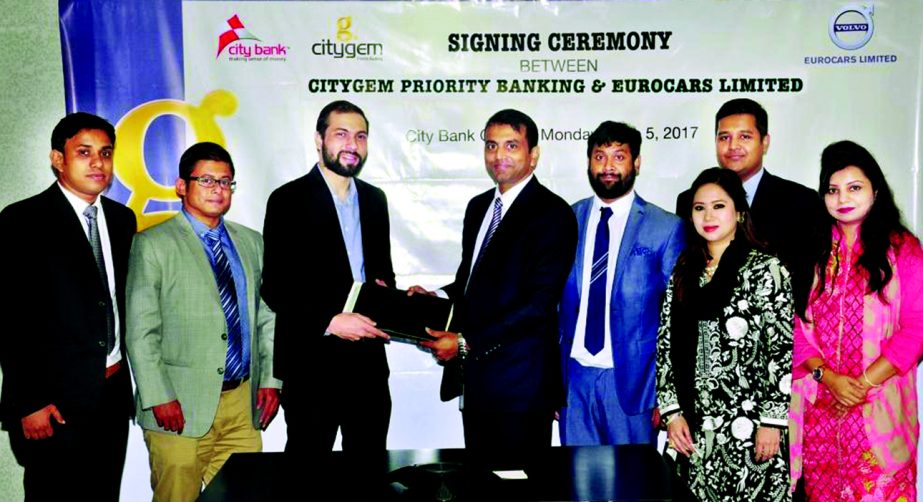 Md Abdul Wadud, DMD of City Bank Ltd. and Yousuf Aman, Director (Operation) of Eurocars Limited, exchanging agreement signing documents at the bank head office in the city recently. Under the deal, members of Citygem, the Priority Banking arm of the bank,