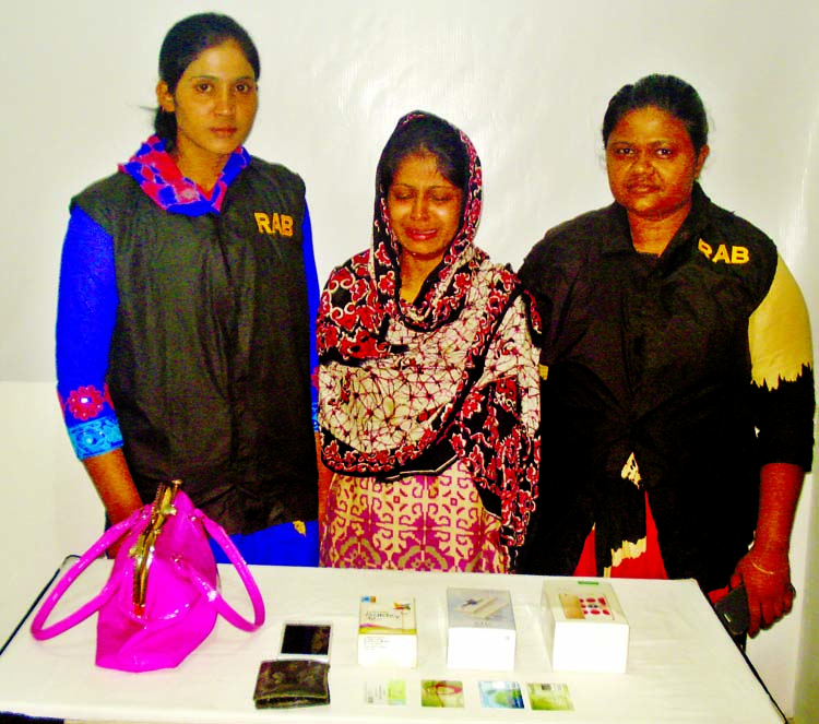 RAB-10 nabbed a young girl namely Laboni Akhtar Nishi along with mobile set and credit card from the city's Demra area on Thursday for her involvement in deceiving people through false love.