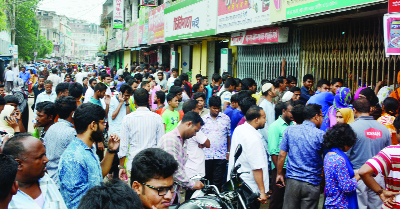BOGRA: Eid home-goers in long queue to collect bus ticket at Satmatha Point in Bogra city on Wednesday.