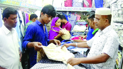 RANGPUR: Eid shoppers passing busy time at Rangpur city markets on Thursday.