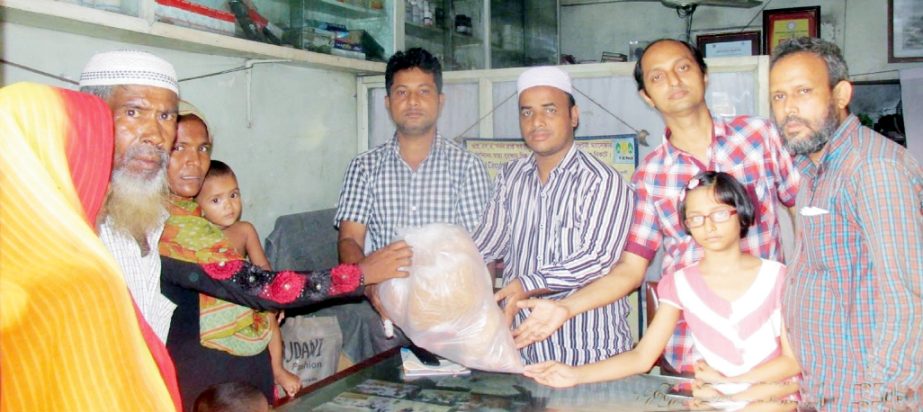 Azizur Rahman Homeopathic Medical College Ex-students Parishads distributing Eid gifts among the poor and distressed people of the society at the Iftar Mahfil on Wednesday.