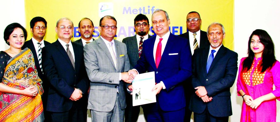Ali Reza Iftekhar Managing Director of EBL and Md. Nurul Islam, Chairman- Bangladesh, Nepal & Myanmar of Metlife, exchanging documents after signing an agreement titled "EBL Salary Shield", a special insurance coverage plan for EBL Pay-roll banking cust