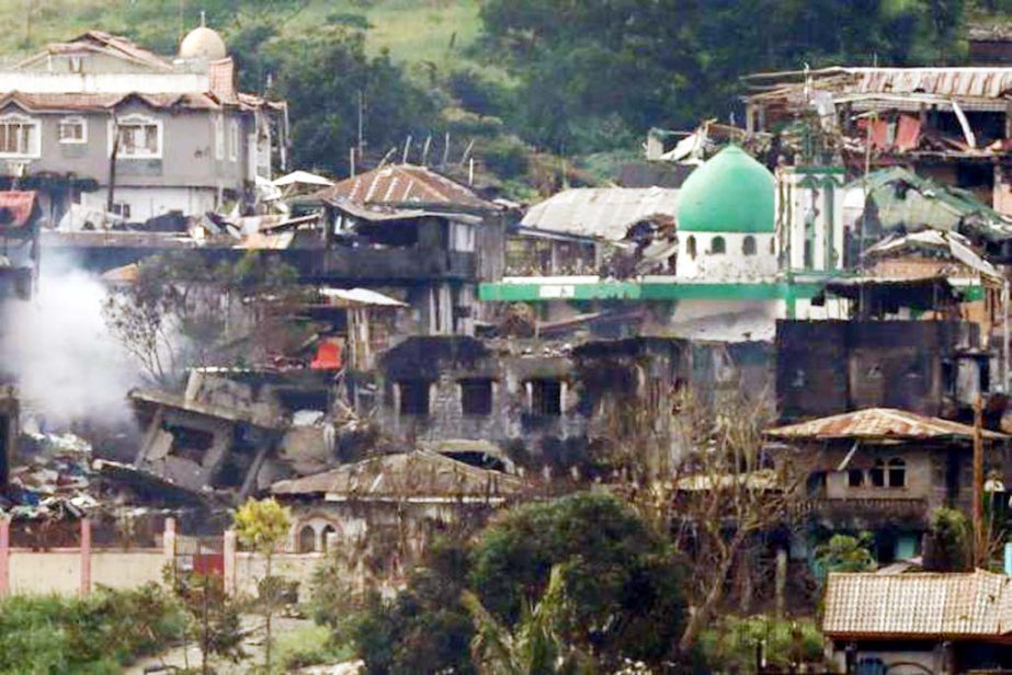 Smoke is seen while Philippines army troops continue their assault against insurgents from the Maute group in Marawi City, Philippines on Wednesday.