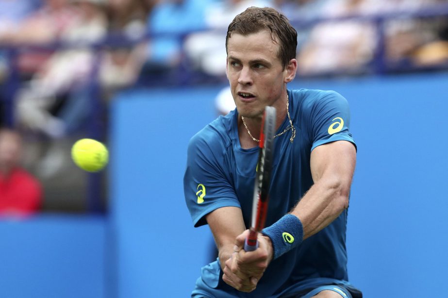 Canada's Vasek Pospisil plays a return to Serbia's Novak Djokovic during their quarterfinal match on day five of the AEGON International tennis tournament at Devonshire Park, Eastbourne, England on Wednesday.