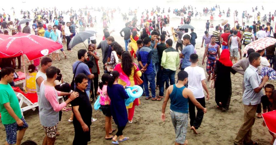 Thousands of Eid holiday-makers enjoying vacation at Cox's Bazar Sea Beach on Wednesday.