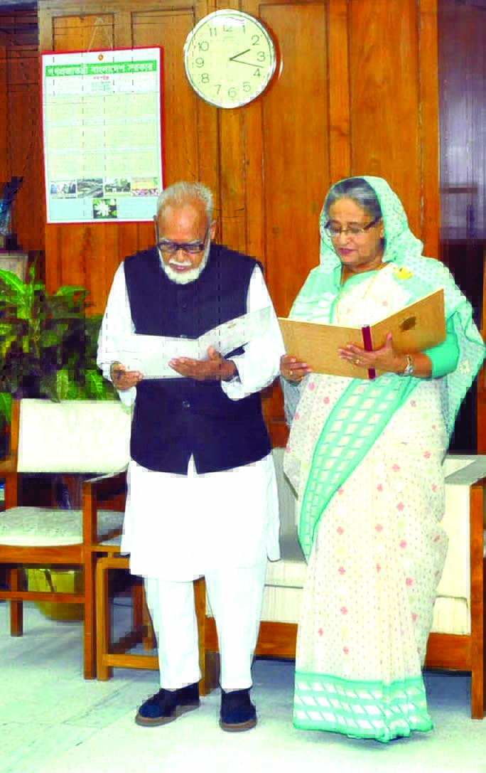 Prime Minister Sheikh Hasina administering oath of office to the newly elected Chairman of Bogra District Council Md. Mokbul Hossain at her office in Jatiya Sangsad Bhaban on Thursday.