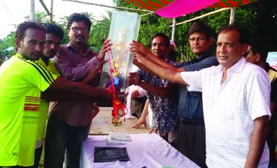 MADHUKHALI(Faridpur): Champion team of seasonal football tournament receiving the trophy organised in memory of formal Madhuklhali Upazila chairman Mofizur Rahman Monju on Wednesday..