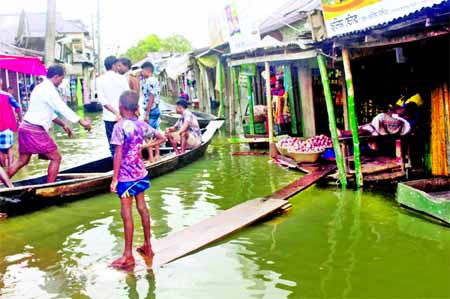 Shops at Fensuganj upazila went under flood water. This photo was taken on Sunday.