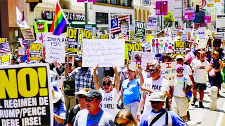 Thousands of protesters marched down 5th Street and Broadway in downtown to Los Angeles City Hall.