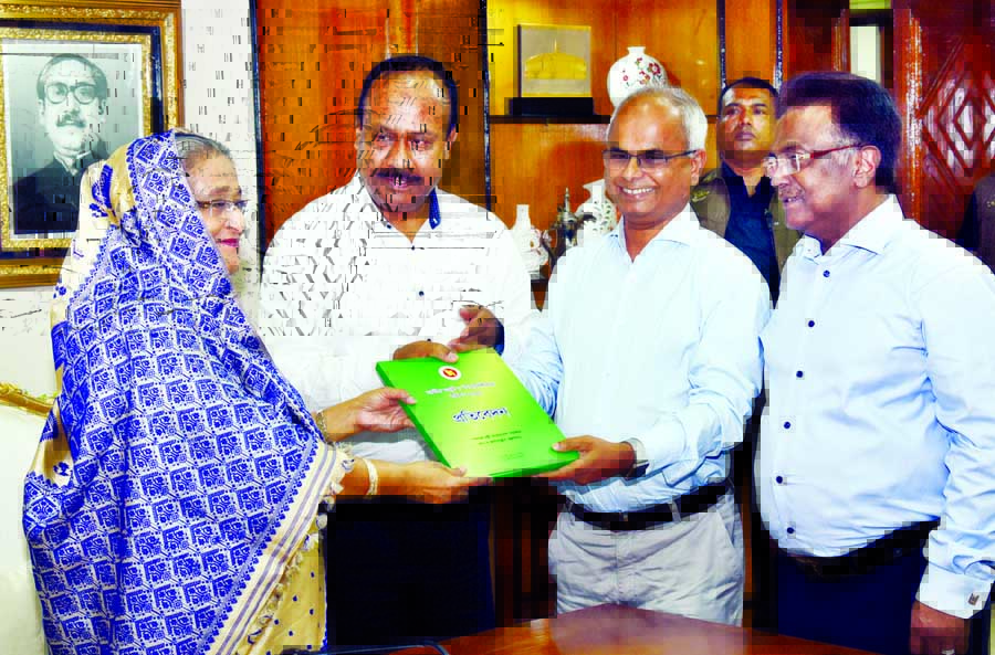 Chairman of the National Wages and Productivity Commission Nazrul Islam Khan handing over the report of the commission to Prime Minister Sheikh Hasina at the latter's office on Tuesday.