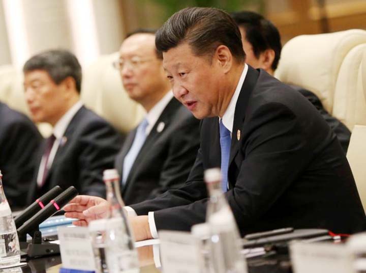 Chinese President Xi Jinping Â® speaks to South Korean President Park Geun-hye (not pictured) during their meeting on the sidelines of the G20 Summit at the West Lake State Guest House in Hangzhou, China.