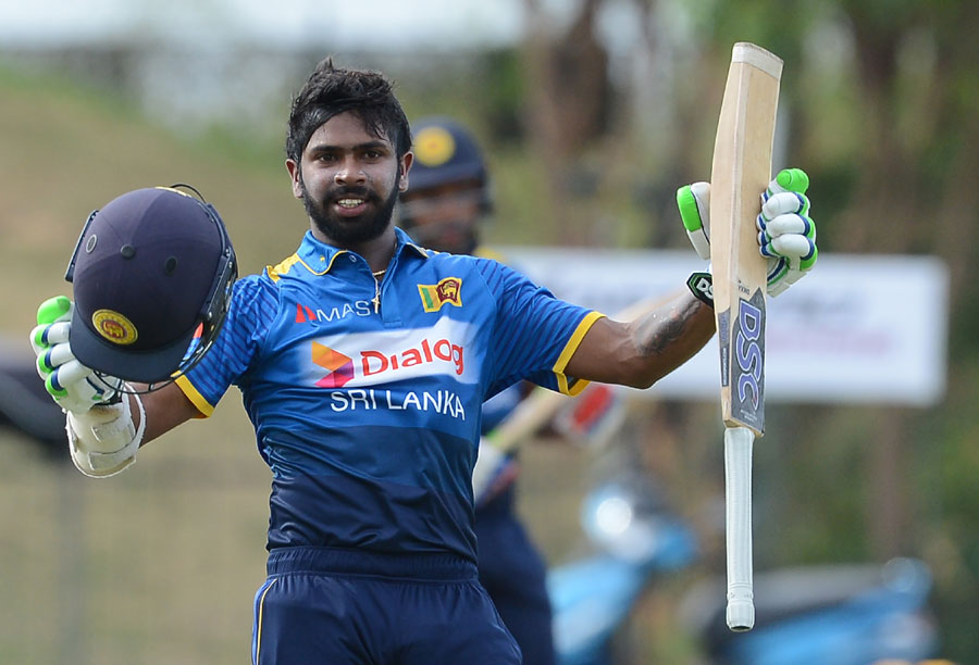 Niroshan Dickwella celebrates his maiden ODI hundred during 3rd ODI between Sri Lanka and Zimbabwe at Hambantota on Thursday.