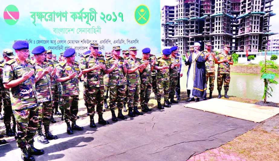 Army Chief General Abu Belal Mohammad Shafiul Haque along with others offering munajat after inaugurating National Tree Plantation programme at Nirjhar Residential area in Dhaka Cantonment on Thursday.