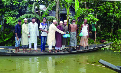 SYLHET: South Surma Upazila Parishad Vice President Shah Md Imad Uddin Nasiri distributing relief goods and cash among the flood victims from his personal fund recently.