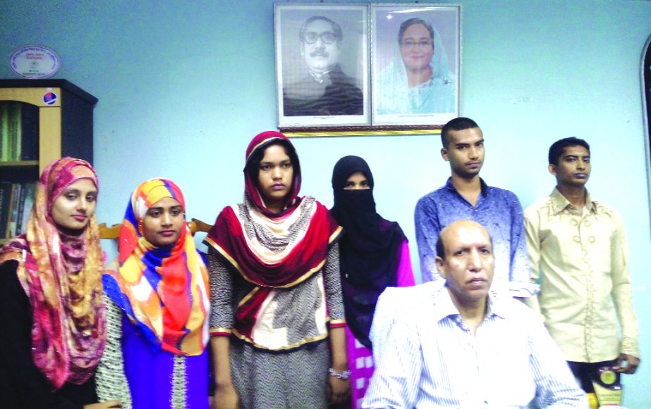 Narendu Shekhor Biswas, Deputy General Manger, Principal Office, Kushtia of Sonali Bank Limited, poses at a scholarship giving ceremony at Kushtia office recently. Seven meritorious students got Tk 10 thousand each.