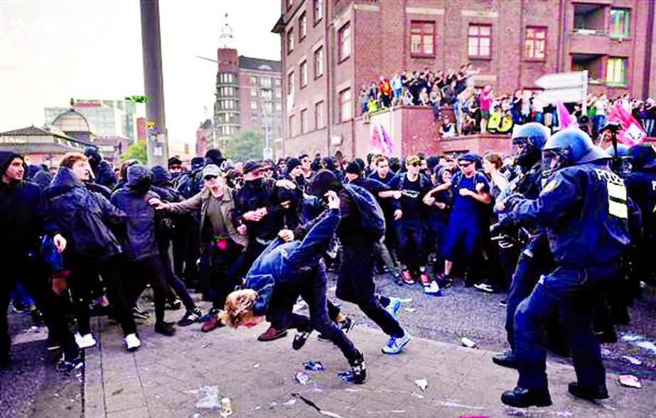 Protesters clash with riot police as they take part in the "Welcome to Hell" protest march on July 6 in Hamburg, Germany.