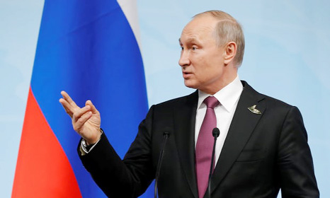 Vladimir Putin speaks during a news conference after the G20 summit.