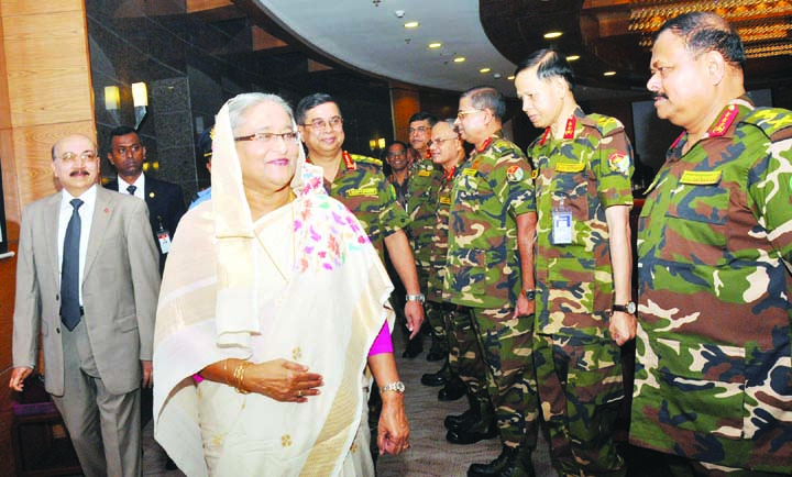 Prime Minister Sheikh Hasina exchanging pleasantries with the high officials of Bangladesh Army at Army Headquarters Selection Board-2017 in the Conference Hall of Army Headquarters, Dhaka Cantonment on Sunday. Photo: BSS