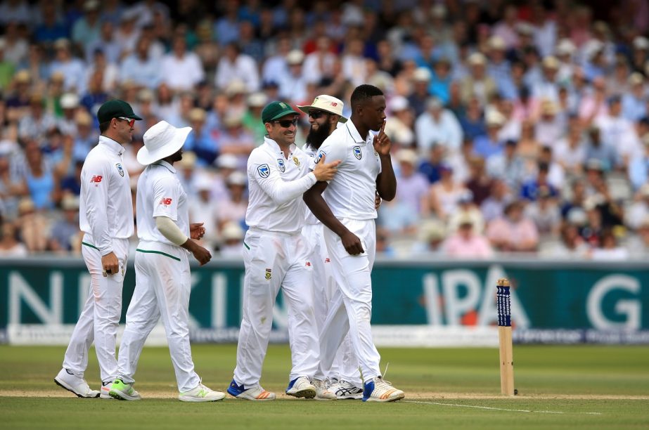 South Africa's Kagiso Rabada (right) celebrates taking the wicket of England's Ben Stokes during day four of the First Investec Test match at Lord's, London on Sunday.