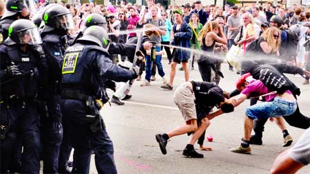 Police use pepper spray during a demonstration on July 8, 2017 in Hamburg, northern Germany as world leaders meet during the G20 summit.