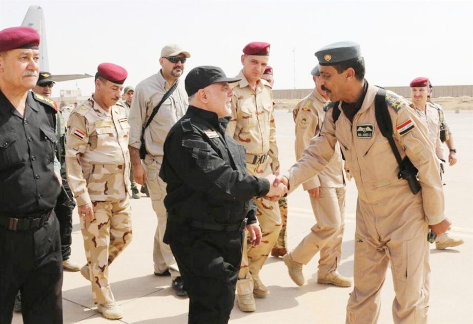 Iraqi PM Haider al-Abadi met Iraqi forces on his arrival in Mosul.