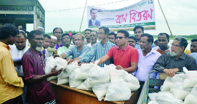 SYLHET: Ali Ahmed, General Secretary, Sylhet District BNP distributing relief among the flood victims at South Surma Upazila recently.