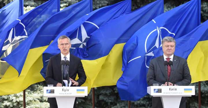 NATO chief Jens Stoltenberg (left) vowed at a press conference in Kiev with President Petro Poroshenko that the alliance stood by Ukraine.