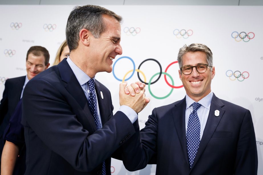 Eric Garcetti Mayor of Los Angeles (left) and Casey Wasserman Chairman of Los Angeles 2024 (right) shake hands during a press conference after the presentation of Los Angeles 2024 Candidate City Briefing for International Olympic Committee (IOC) Members,