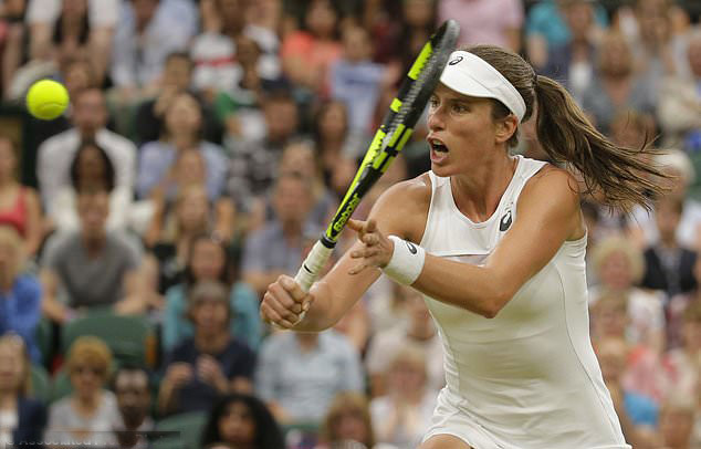 Britain's Johanna Konta returns to Romania's Simona Halep during their Women's Quarterfinal Singles Match on day eight at the Wimbledon Tennis Championships in London on Tuesday.