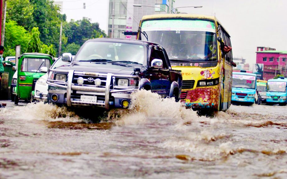 Incessant rains lashed the capital leading to waterlogging in different parts of the city, went under knee-deep water, causing untold sufferings to commuters and city dwellers. This photo was taken from Dhanmondi area on Wednesday.