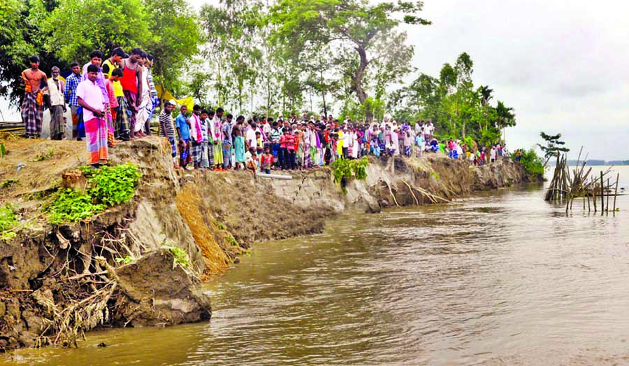 Severe erosion of Brahmaputra River engulfs fresh areas of cross dam under Rowmari upazila of Kurigram due to onrush of holly waters. Thousands of villagers passing days in grief. This photo was taken on Wednesday.