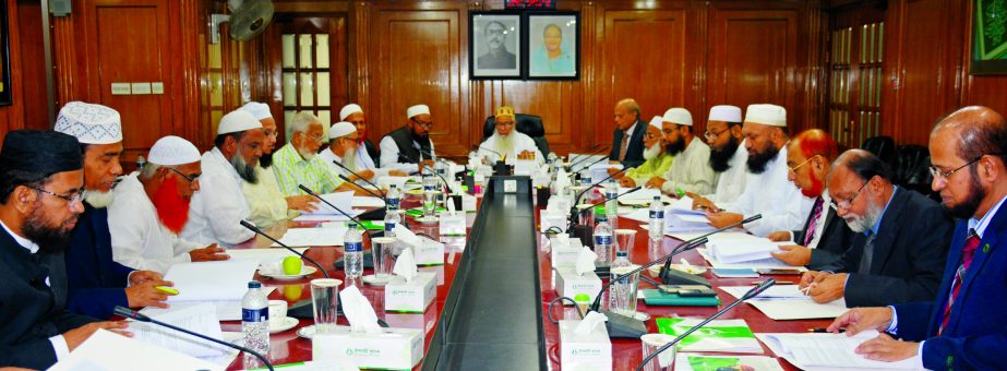 Sheikh Moulana Mohammad Qutubuddin, Chairman, Shariah Supervisory Committee of Islami Bank Bangladesh Limited, presiding over the Shariah meeting at the bank's head office on Sunday. Dr. Mohammad Abdus Samad, Member Secretary and other members of the Com