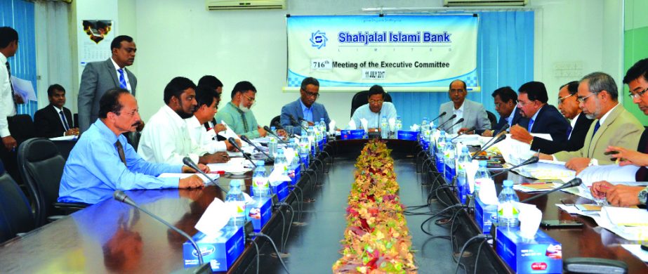 Akkas Uddin Mollah, Director of Shahjalal Islami Bank Limited, presiding over its 716th EC meeting at the bank's head office in the city recently. Farman R Chowdhury, Managing Director, AK Azad, Engineer Md. Towhidur Rahman, Mohammed Younus, Fakir Akhtar