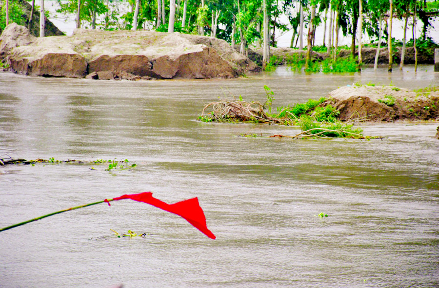 The old embankment in Chandonbaisha area under Sariakandi Upazila of Bogra district washed away by heavy current of waters at Jamuna River, creating panic among the people. This photo was taken on Thursday.