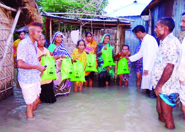 GANGACHARA ( Rangpur): C M Sadik , an industrialist and social worker is distributing relief goods among the flood-hit people on Thursday .