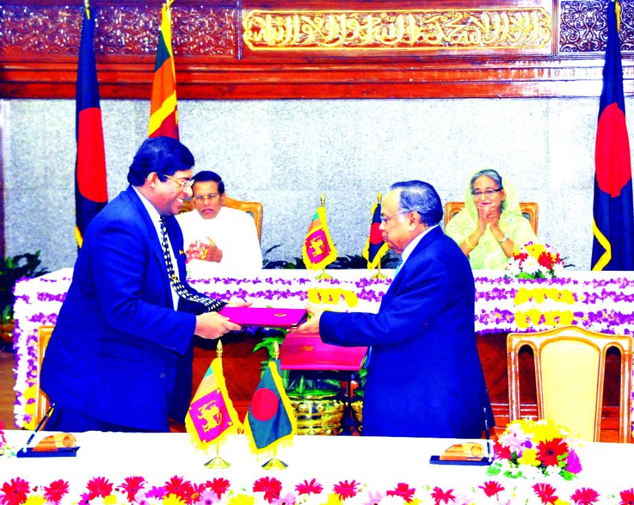 14 agreements and MoU were signed between Bangladesh and Sri Lanka at the Prime Minister's office on Friday. Prime Minister Sheikh Hasina and visiting Sri Lankan President Maithripala Sirisena were present on the occasion.