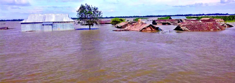 Many houses, school of Namachar village under Jamalpur-Islampur upazila were inundated by the onrush of hilly waters. Thousands of flood victims face immense sufferings due to lack of food, pure drinking water, medicine and shelter. This photo was taken o