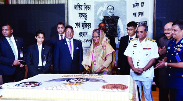 Prime Minister Sheikh Hasina cutting cake marking 31st founding anniversary of SSF at SSF Mess in the city's Tejgaon on Saturday. BSS photo