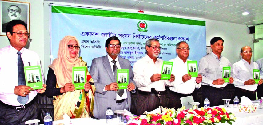 Chief Election Commissioner KM Nurul Huda along with other distinguished persons holds the copies of Roadmap of the Eleventh National Election at its cover unwrapping ceremony at the Election Commission Secretariat in the city on Sunday.