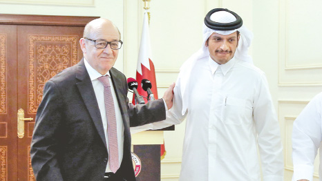 French Minister of Europe and Foreign Affairs Jean-Yves Le Drian (L) and his Qatari counterpart Mohammed bin Abdulrahman al-Thani walk out of a press conference in the Qatari capital Doha.