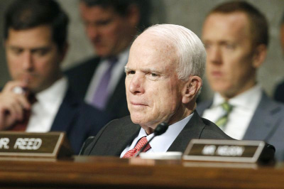 Senate Armed Services Committee Chairman Sen. John McCain, R-Ariz. listens on Capitol Hill in Washington, during the committee's confirmation hearing for Nay Secretary nominee Richard Spencer.