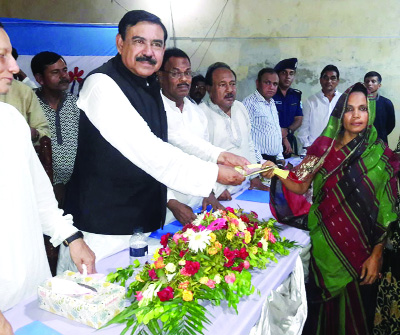 TAKERHAT( Madaripur): Shipping Minister Shajahan Khan MP distributing benefits under Coastal Climate Resilient Infrastructure Project(CCRIP) at Rajoir Upazila yesterday.